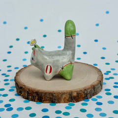 Zombie Cat with a Daisy on its Head