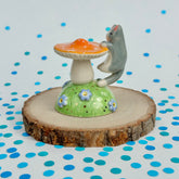 Gray Tuxedo on an Orange Mushroom